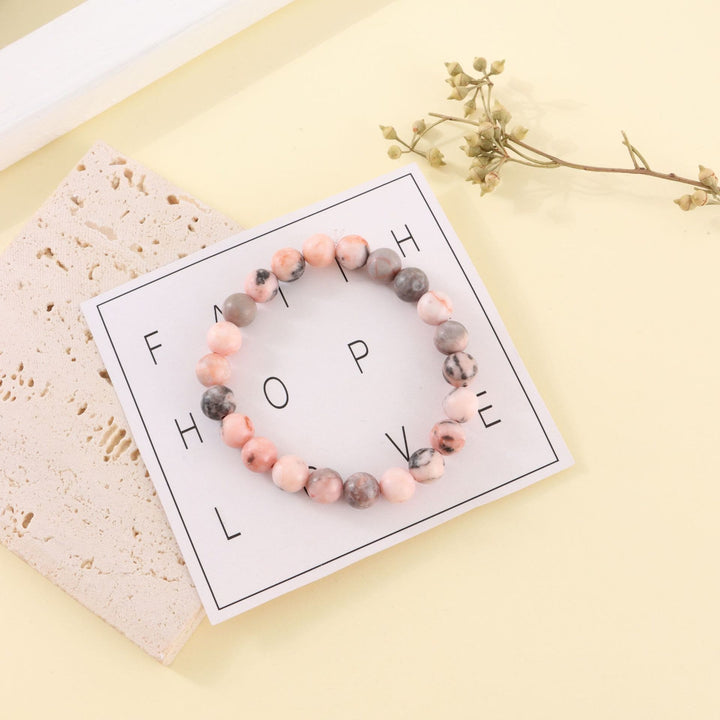 Bracelet de perles fait main en pierre zébrée rose rhodochrosite Olivenorma de 8 mm