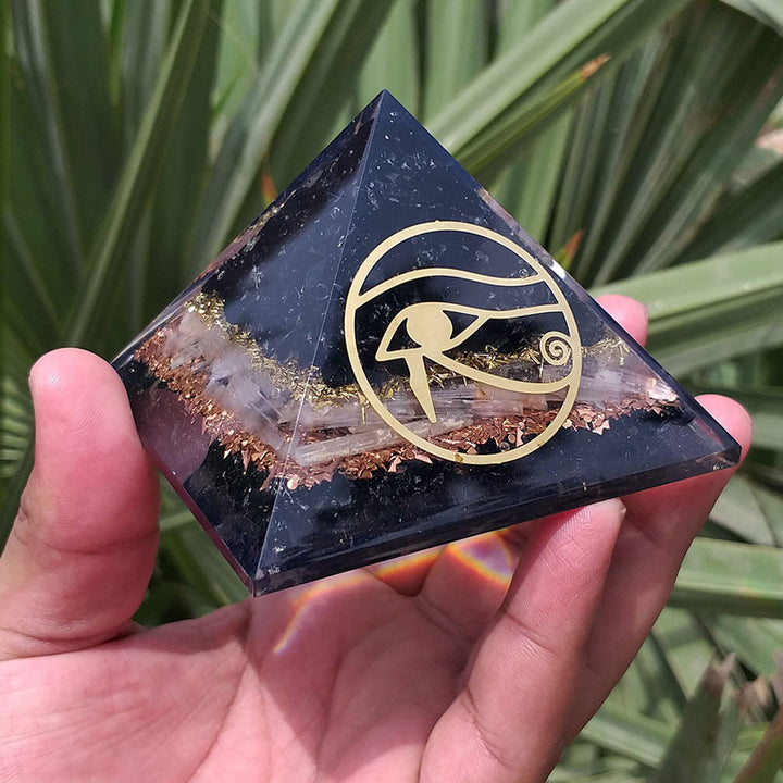 Pyramide d'orgone de protection en obsidienne Olivenorma Oeil d'Horus