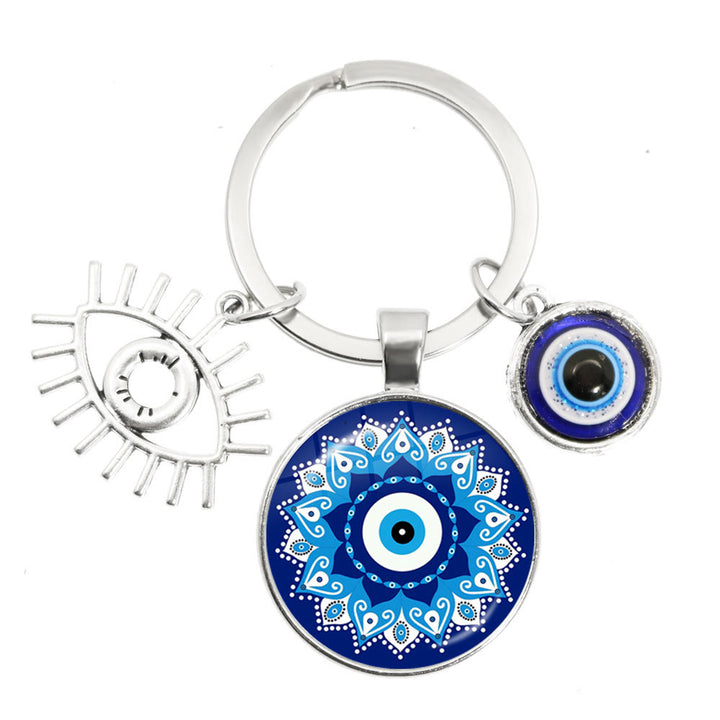 Porte-clés en époxy bleu mauvais œil Hamsa Olivenorma