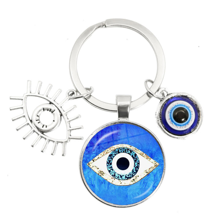 Porte-clés en époxy bleu mauvais œil Hamsa Olivenorma