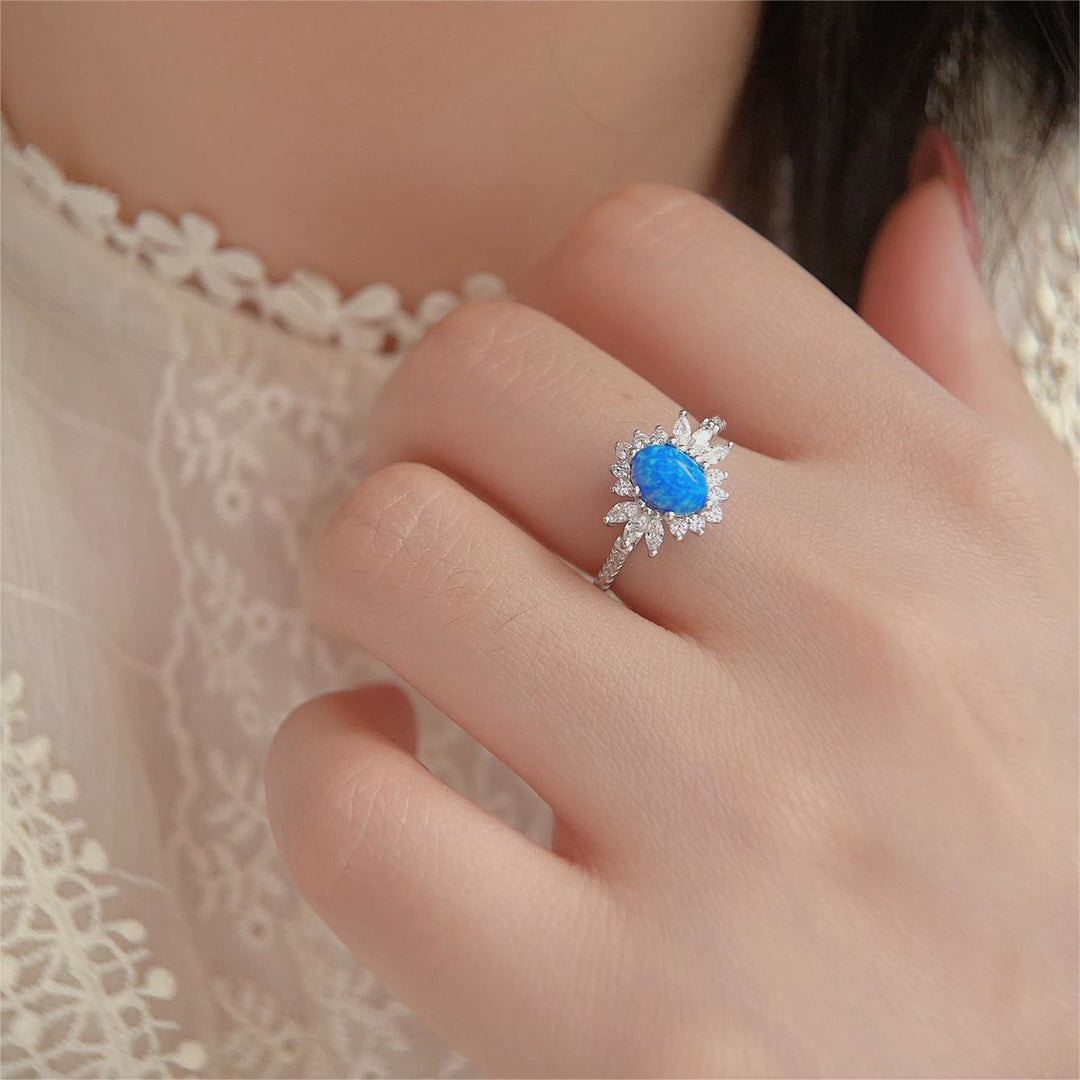 Bague en argent 925 avec motif tournesol et opale blanche et bleue Olivenorma