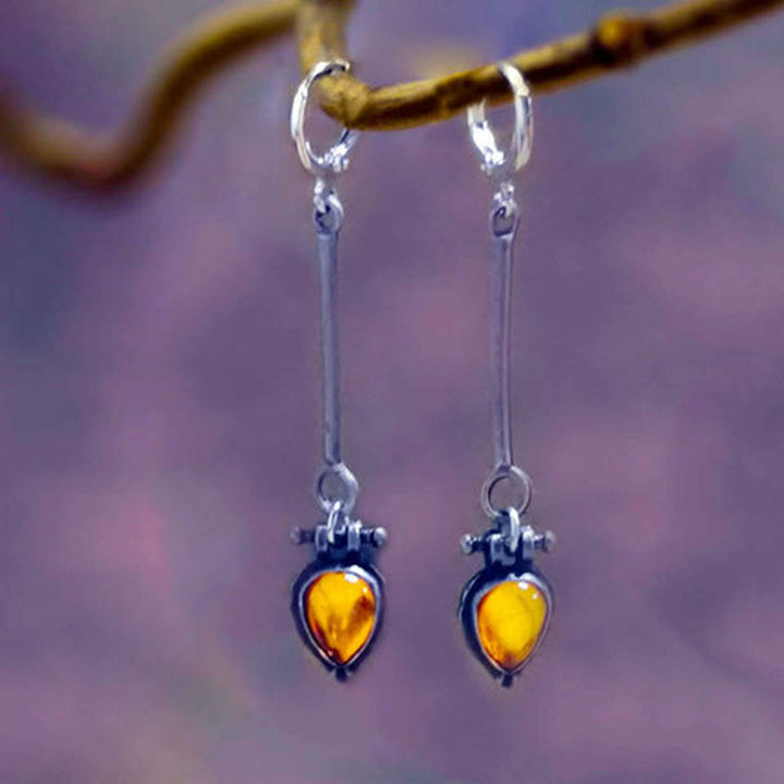 Boucles d'oreilles en pierre d'ambre en forme de goutte d'eau de la tribu Olivenorma