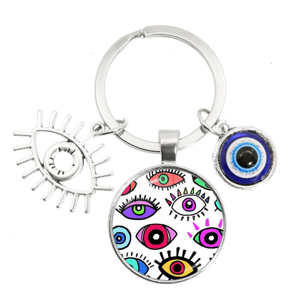 Porte-clés en époxy bleu mauvais œil Hamsa Olivenorma