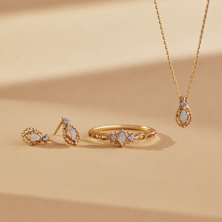 Collier, boucles d'oreilles et bague en dentelle violette naturelle d'opale Olivenorma