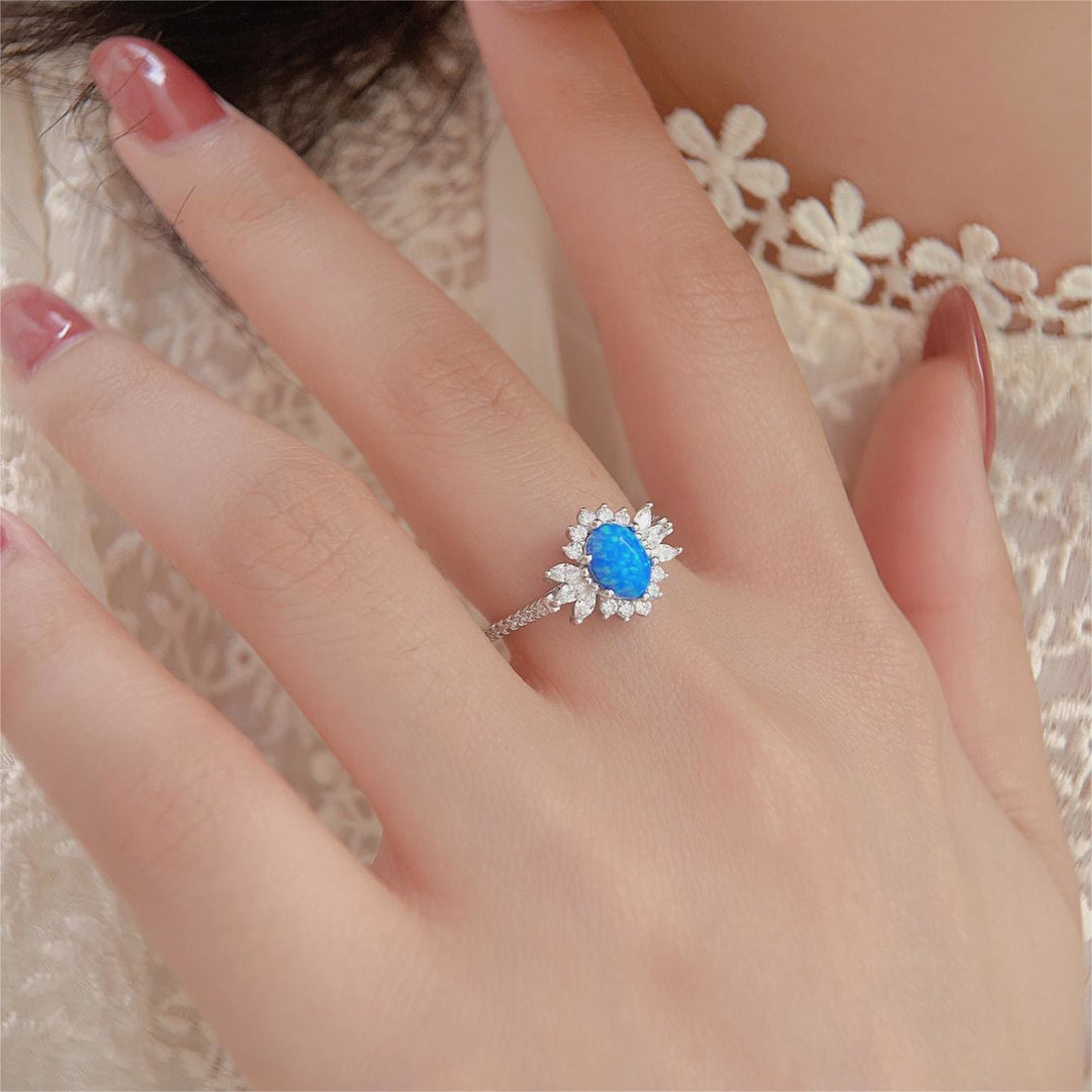 Bague en argent 925 avec motif tournesol et opale blanche et bleue Olivenorma