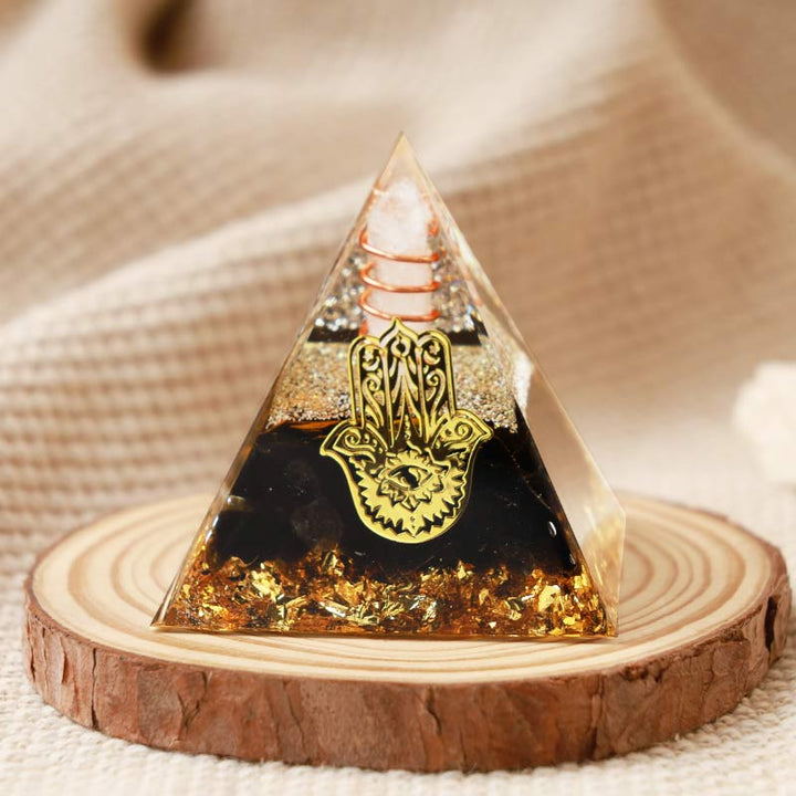 Cristal transparent Olivenorma avec pyramide orgonite Hamsa en obsidienne