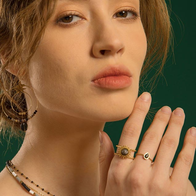 Bague Olivenorma en forme d'étoile à huit branches et à double rangée de tournesols