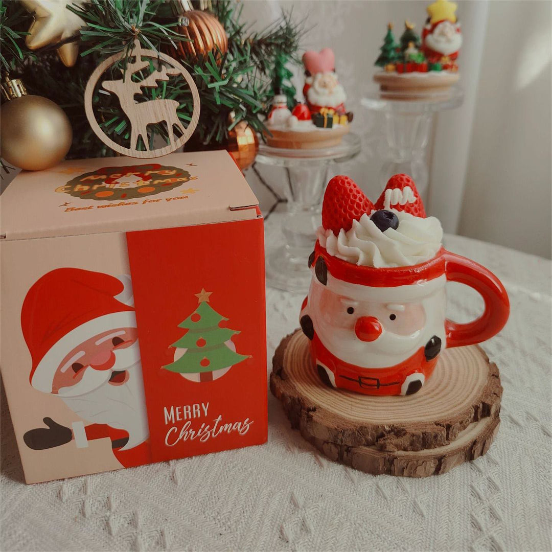 Bougie de Noël en forme de tasse de Père Noël, bonhomme de neige et élan Olivenorma