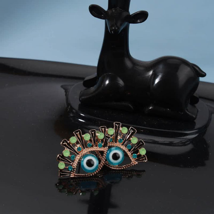 Olivenorma « Eye of Doom » - Boucles d'oreilles paon créatives en saphir