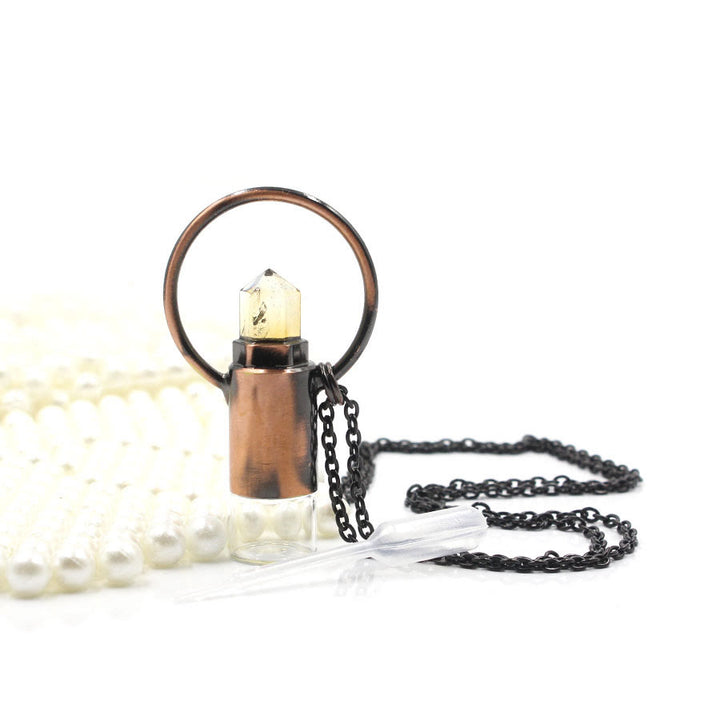 Pendentif bouteille de parfum en cristal naturel prismatique Olivenorma