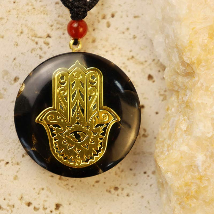 Collier de transformation en obsidienne avec Hamsa