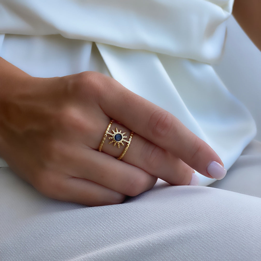 Bague Olivenorma en forme d'étoile à huit branches et à double rangée de tournesols