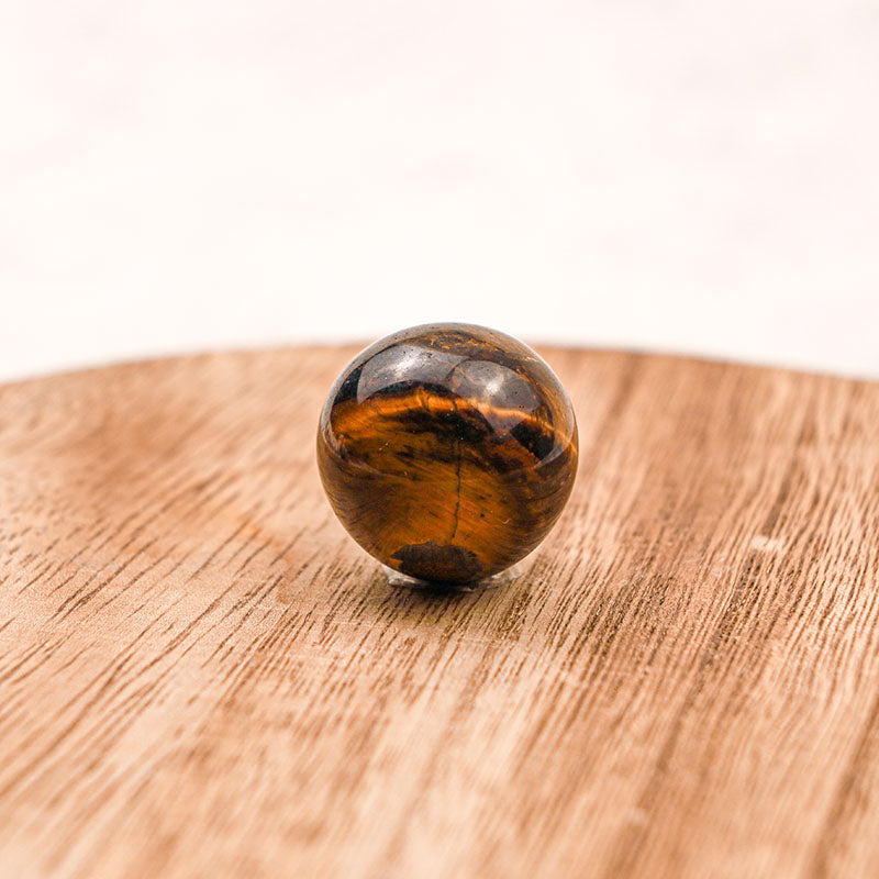 Sphère de cristal de protection en œil de tigre Olivenorma