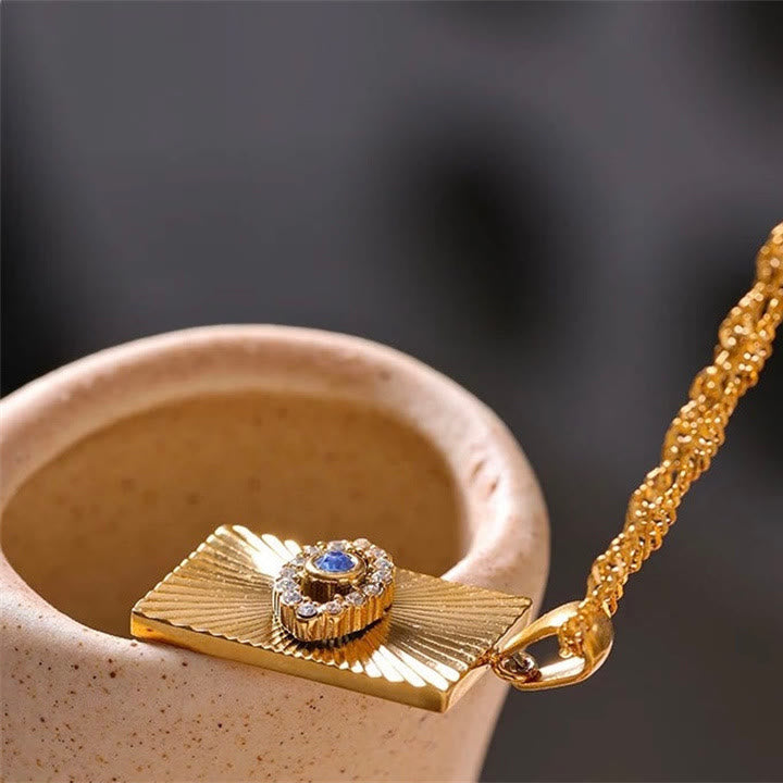 Collier Olivenorma avec topaze bleue et zircon blanc mauvais œil