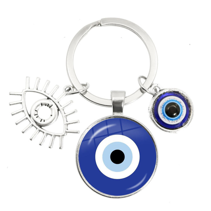 Porte-clés en époxy bleu mauvais œil Hamsa Olivenorma