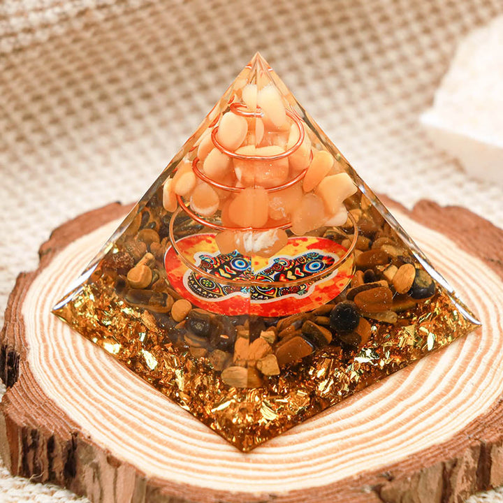 Pierre de soleil Olivenorma avec œil de tigre Pyramide Orgone Hamsa