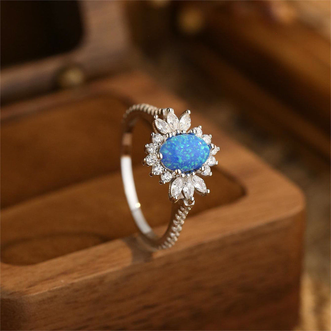 Bague en argent 925 avec motif tournesol et opale blanche et bleue Olivenorma