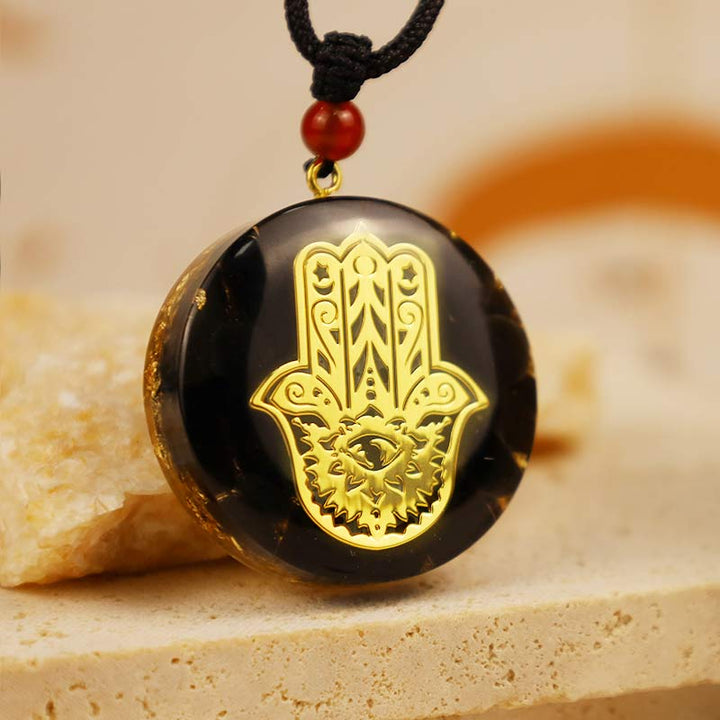 Collier de transformation en obsidienne avec Hamsa