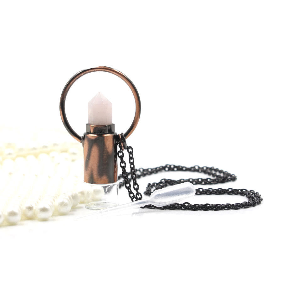 Pendentif bouteille de parfum en cristal naturel prismatique Olivenorma