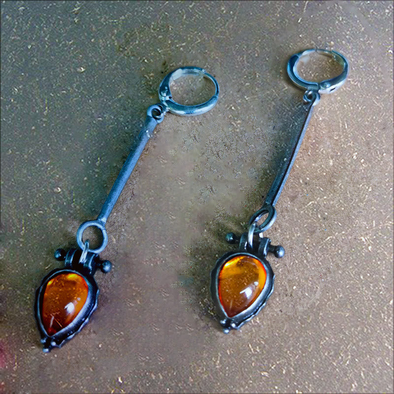 Boucles d'oreilles en pierre d'ambre en forme de goutte d'eau de la tribu Olivenorma