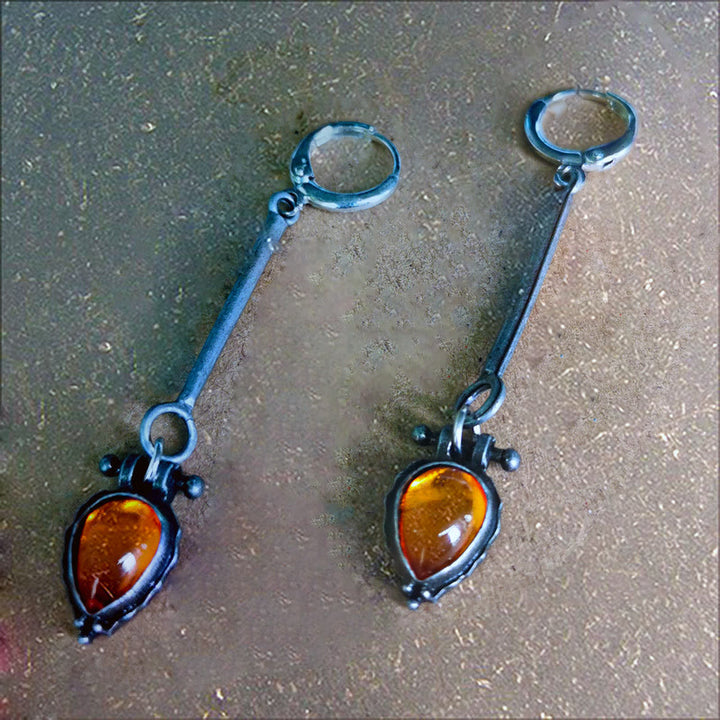Boucles d'oreilles en pierre d'ambre en forme de goutte d'eau de la tribu Olivenorma