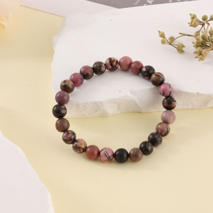 Bracelet de perles fait main en pierre zébrée rose rhodochrosite Olivenorma de 8 mm