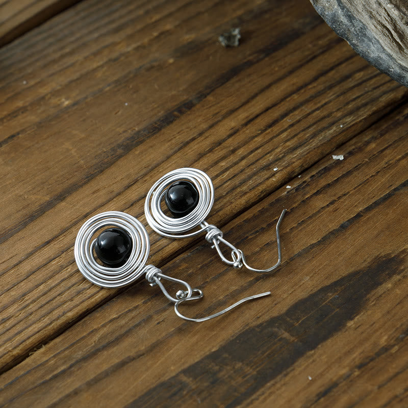 Boucles d'oreilles créoles infinies en fil de fer punk en obsidienne Olivenorma