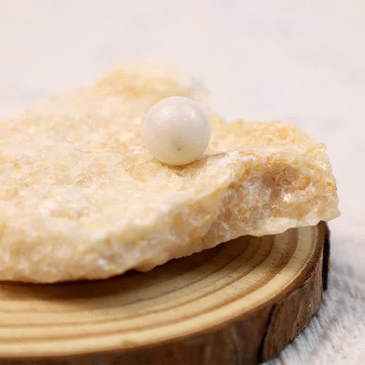 Sphère de cristal de transformation en jade blanc Olivenorma
