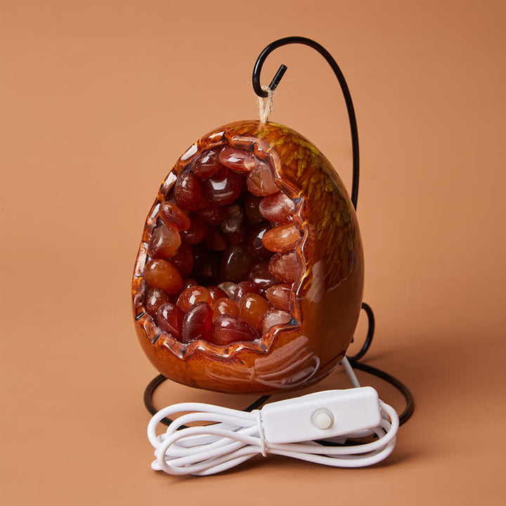 Décoration de grotte en cristal avec pierre précieuse en forme d'œuf de dinosaure Olivenorma