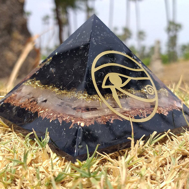Pyramide d'orgone de protection en obsidienne Olivenorma Oeil d'Horus