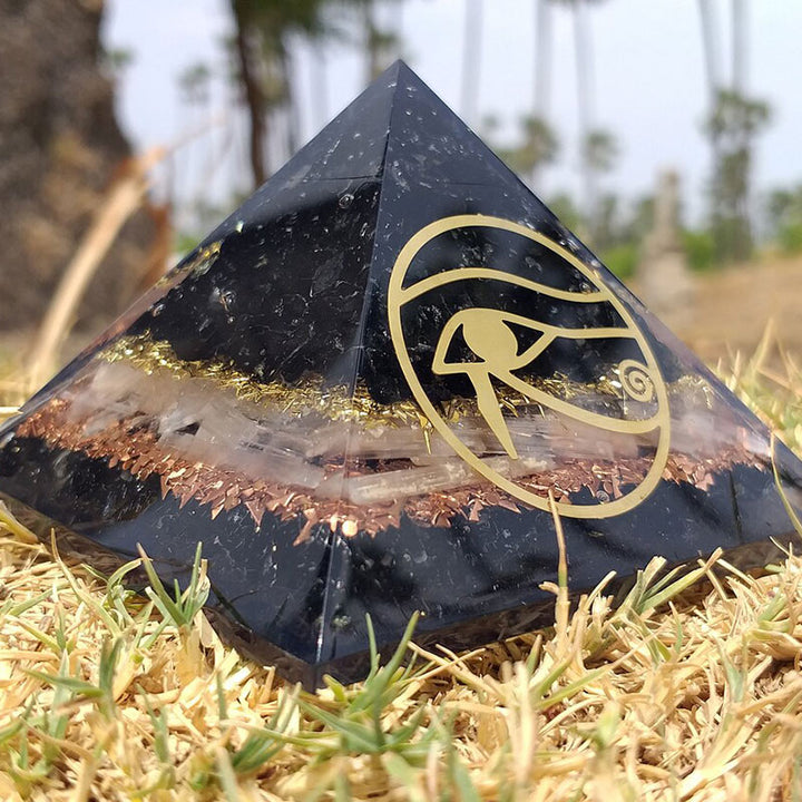 Pyramide d'orgone de protection en obsidienne Olivenorma Oeil d'Horus