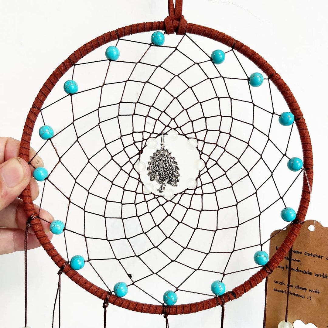 Attrape-rêves en plumes de paon fait main avec perles phosphorescentes Olivenorma