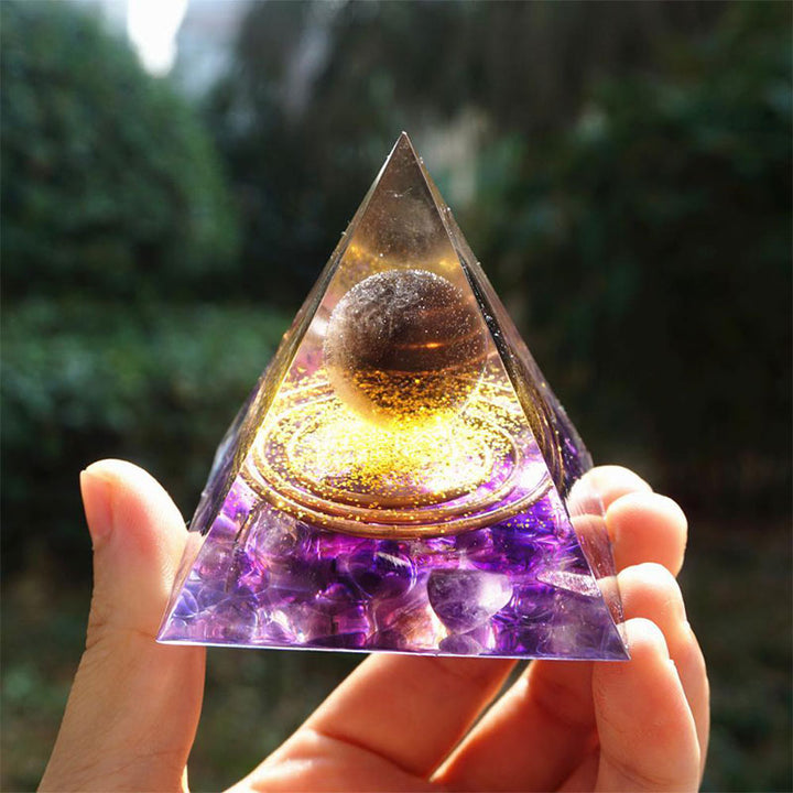 Boule de quartz fumé Olivenorma avec pyramide d'orgone en améthyste