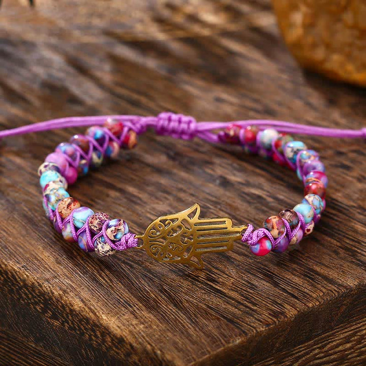 Le bracelet Hamsa en pierre violette de l'empereur de la conscience spirituelle
