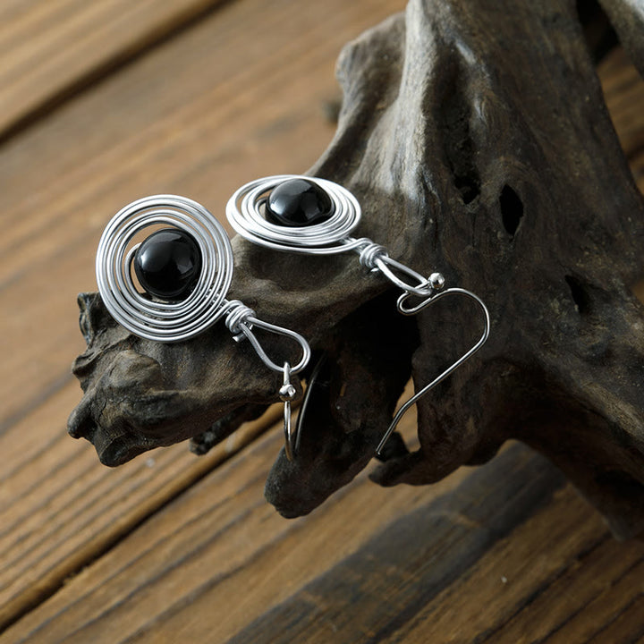 Boucles d'oreilles créoles infinies en fil de fer punk en obsidienne Olivenorma