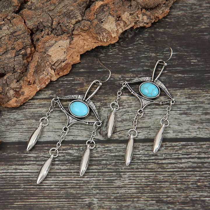 Boucles d'oreilles bohèmes en turquoise avec découpes géométriques Olivenorma