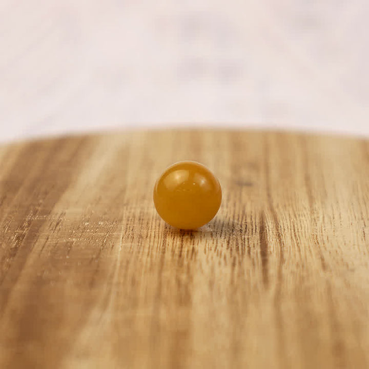 Sphère de cristal positive en jade jaune Olivenorma
