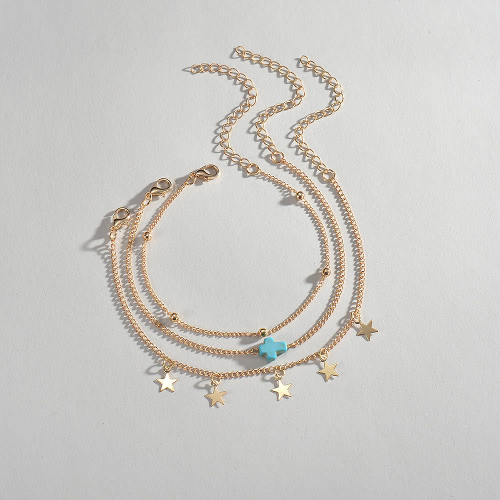 Bracelet de cheville multicouches pour femme avec pompon croisé et étoile de plage Olivenorma