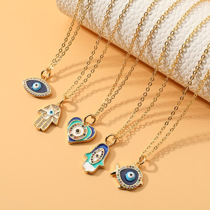 Collier en époxy en forme de cœur avec le mauvais œil Hamsa Olivenorma