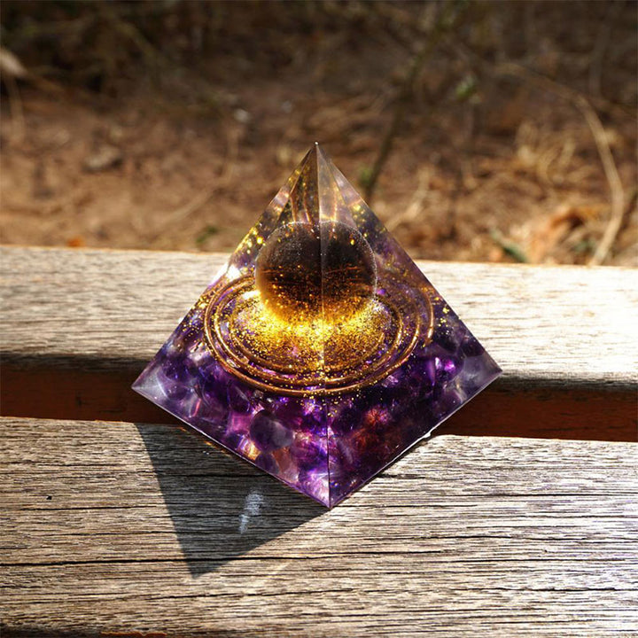 Boule de quartz fumé Olivenorma avec pyramide d'orgone en améthyste