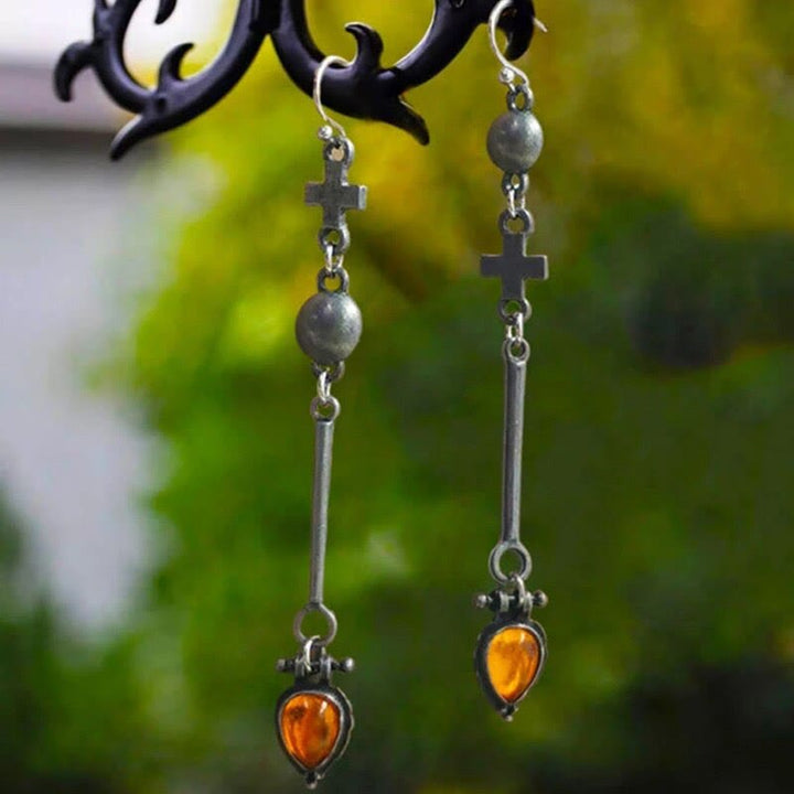 Boucles d'oreilles en pierre d'ambre en forme de goutte d'eau de la tribu Olivenorma