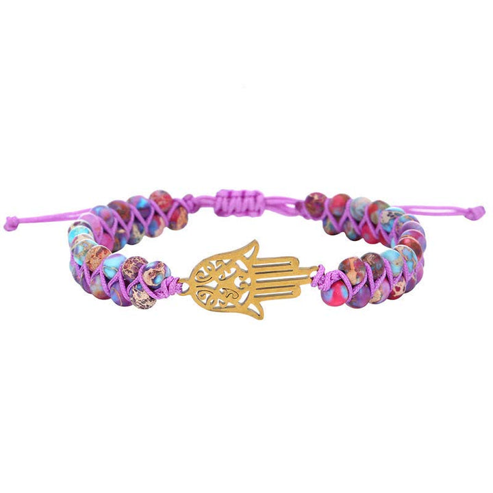 Le bracelet Hamsa en pierre violette de l'empereur de la conscience spirituelle