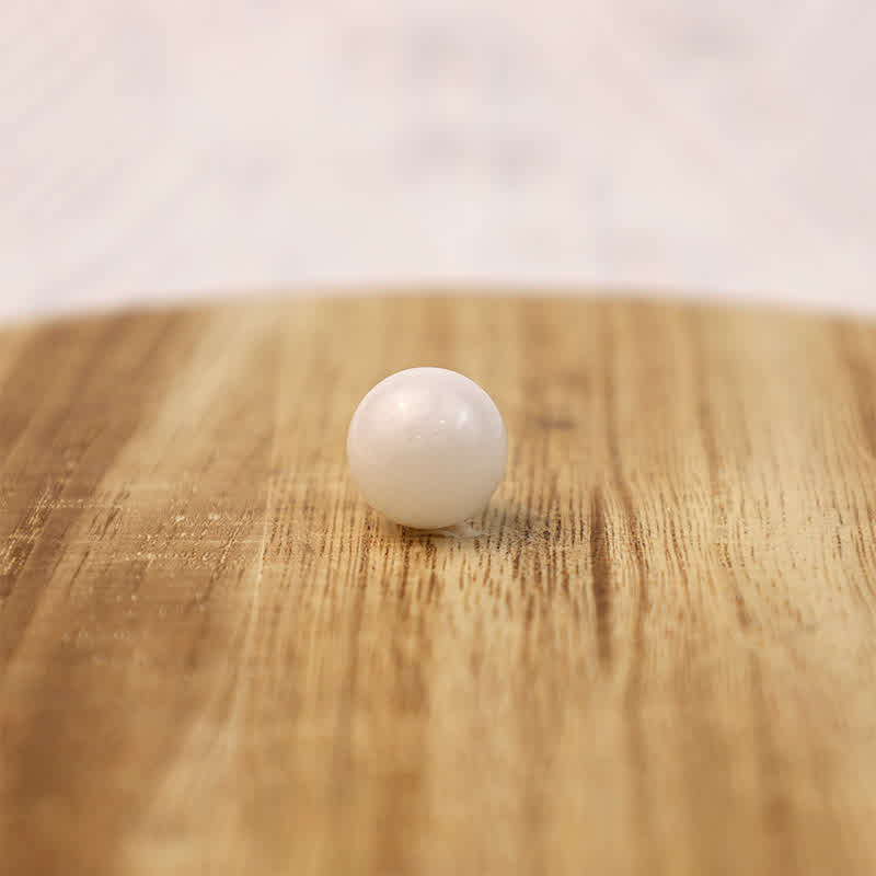 Sphère de cristal de transformation en jade blanc Olivenorma