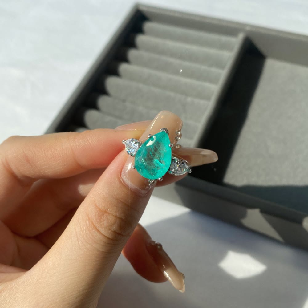 Bague exquise en zircon blanc et tourmaline Paraiba Olivenorma