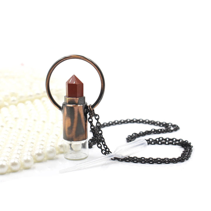 Pendentif bouteille de parfum en cristal naturel prismatique Olivenorma