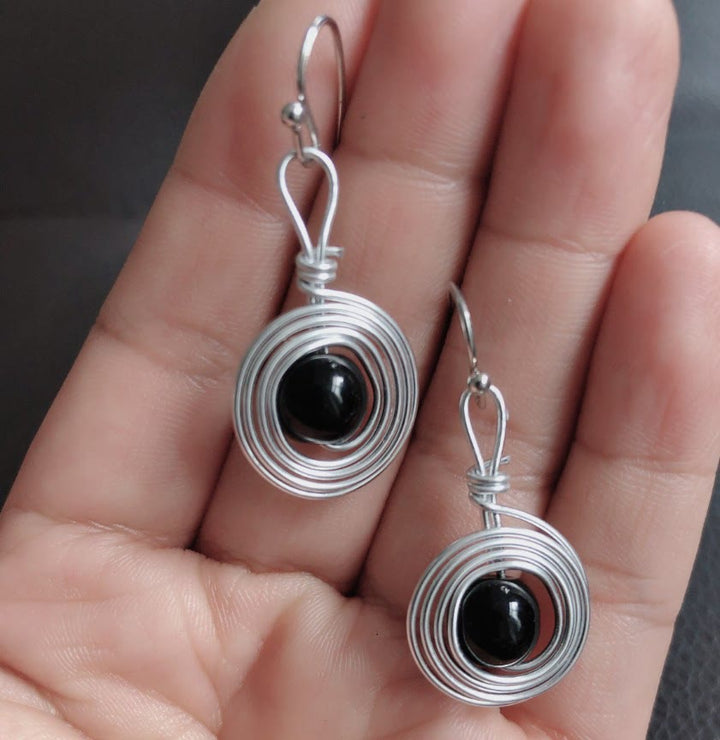 Boucles d'oreilles créoles infinies en fil de fer punk en obsidienne Olivenorma