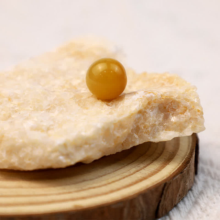 Sphère de cristal positive en jade jaune Olivenorma