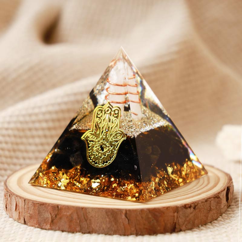 Cristal transparent Olivenorma avec pyramide orgonite Hamsa en obsidienne