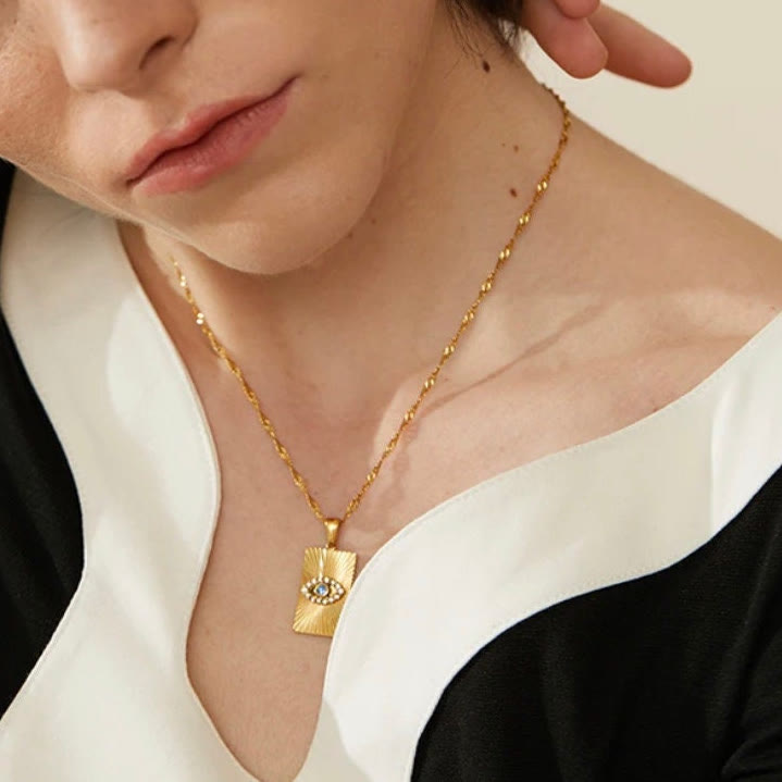 Collier Olivenorma avec topaze bleue et zircon blanc mauvais œil