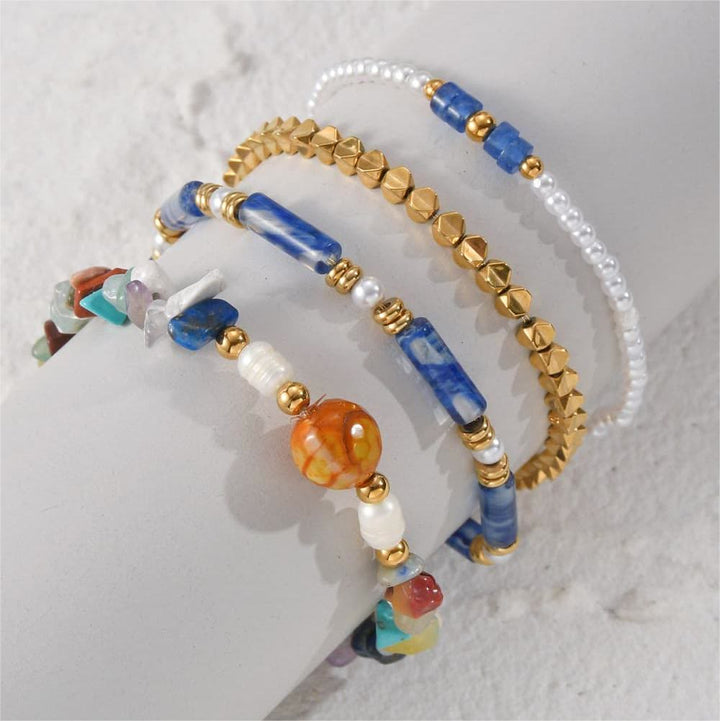 Ensemble de quatre bracelets en perles de cristal naturel Olivenorma